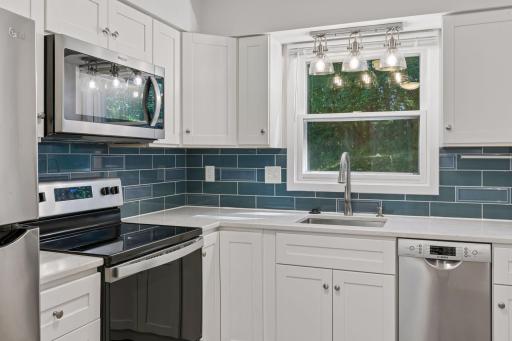 Newer cabinets installed, stone countertops, tile backsplash, stainless steel appliances....everything is done! READY TO ENJOY!