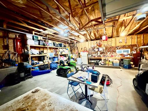 Large Garage with floor drain and storage