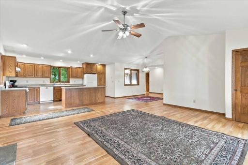 Vaulted ceilings with dining space towards the back of the photo