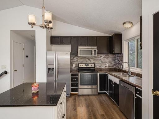Updated Kitchen with Stainless Steel and Tile backsplash
