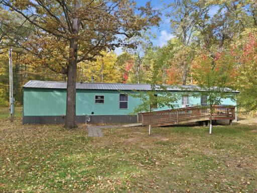 Front of the home with wheelchair ramp for easy entry