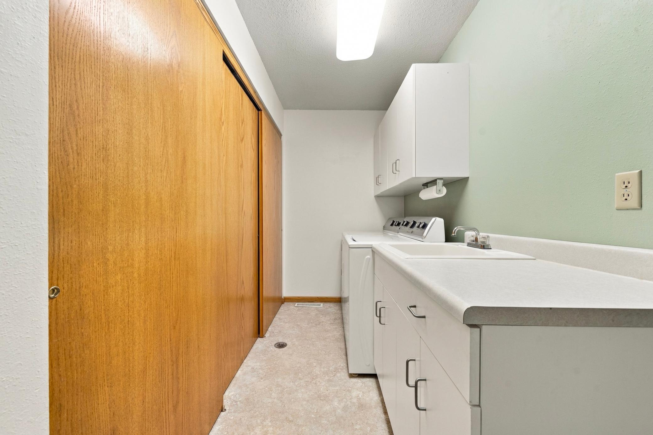 Laundry room with lots of storage - all utilities conveniently located in the large closet