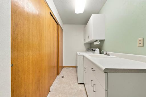 Laundry room with lots of storage - all utilities conveniently located in the large closet