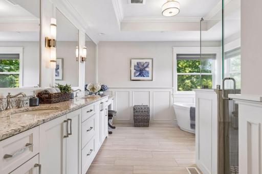 Spa-like primary bath with dual vanities.