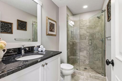Private en suite bath with walk-in shower.