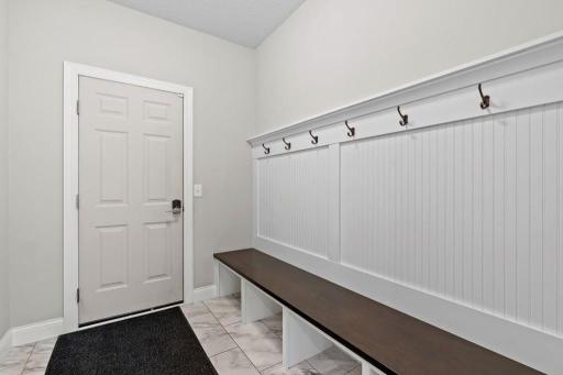 Spacious mud-hall off of garage.