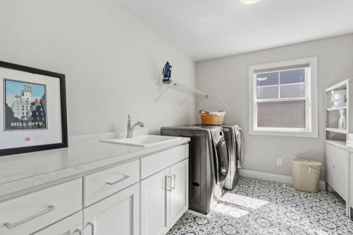 Spacious upper-level laundry off of the master suite.