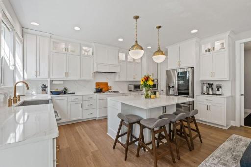 The oversized kitchen provides plenty of prep space while keeping everyone connected.