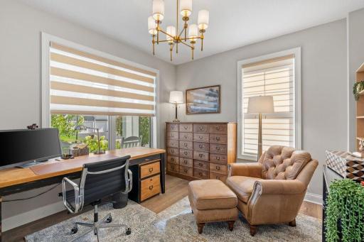 Spacious front office or future library or music room.