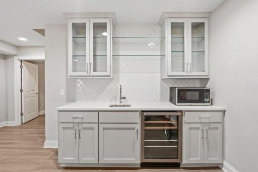 Custom built-in wet bar in lower level.