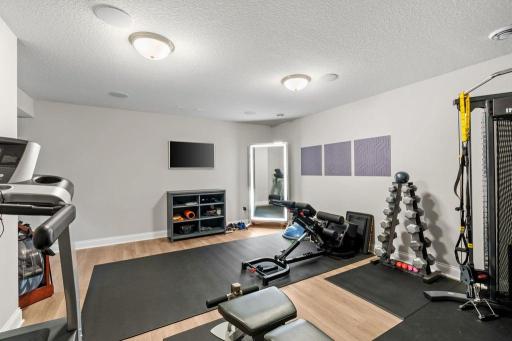 Large media/workout room in lower level.
