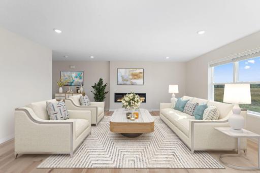 Family Room with fireplace. Photos are from a staged model and may vary slightly from actual.
