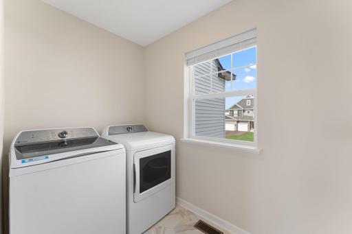 Upstairs laundry - washer/dryer included. Not actual home but similar floorplan.