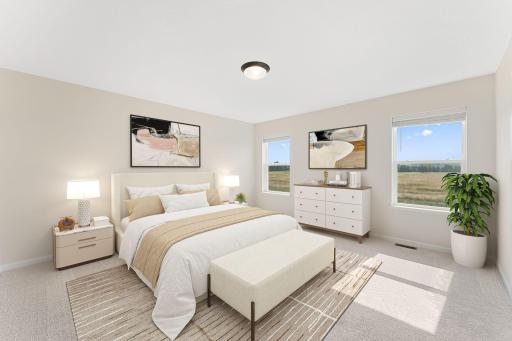 Owner's bedroom with ensuite bath/walk-in closet. Photos are from a staged model and may vary slightly from actual.