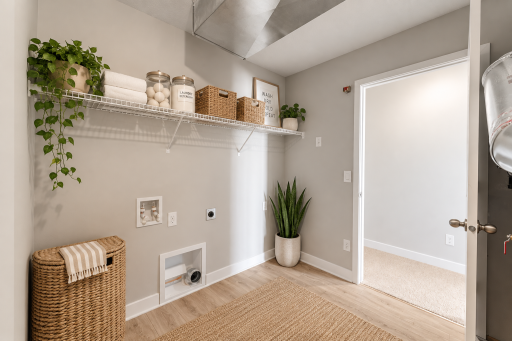 Upper level laundry. *Photo of similar home.