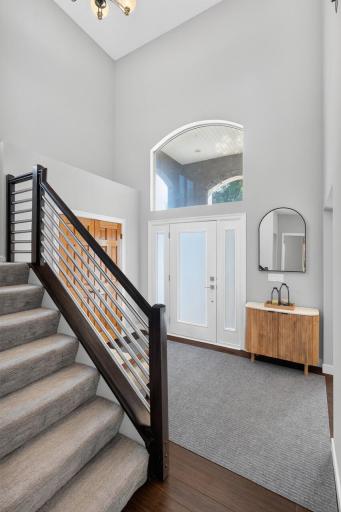 Gorgeous two-story foyer with a beautiful modern staircase.