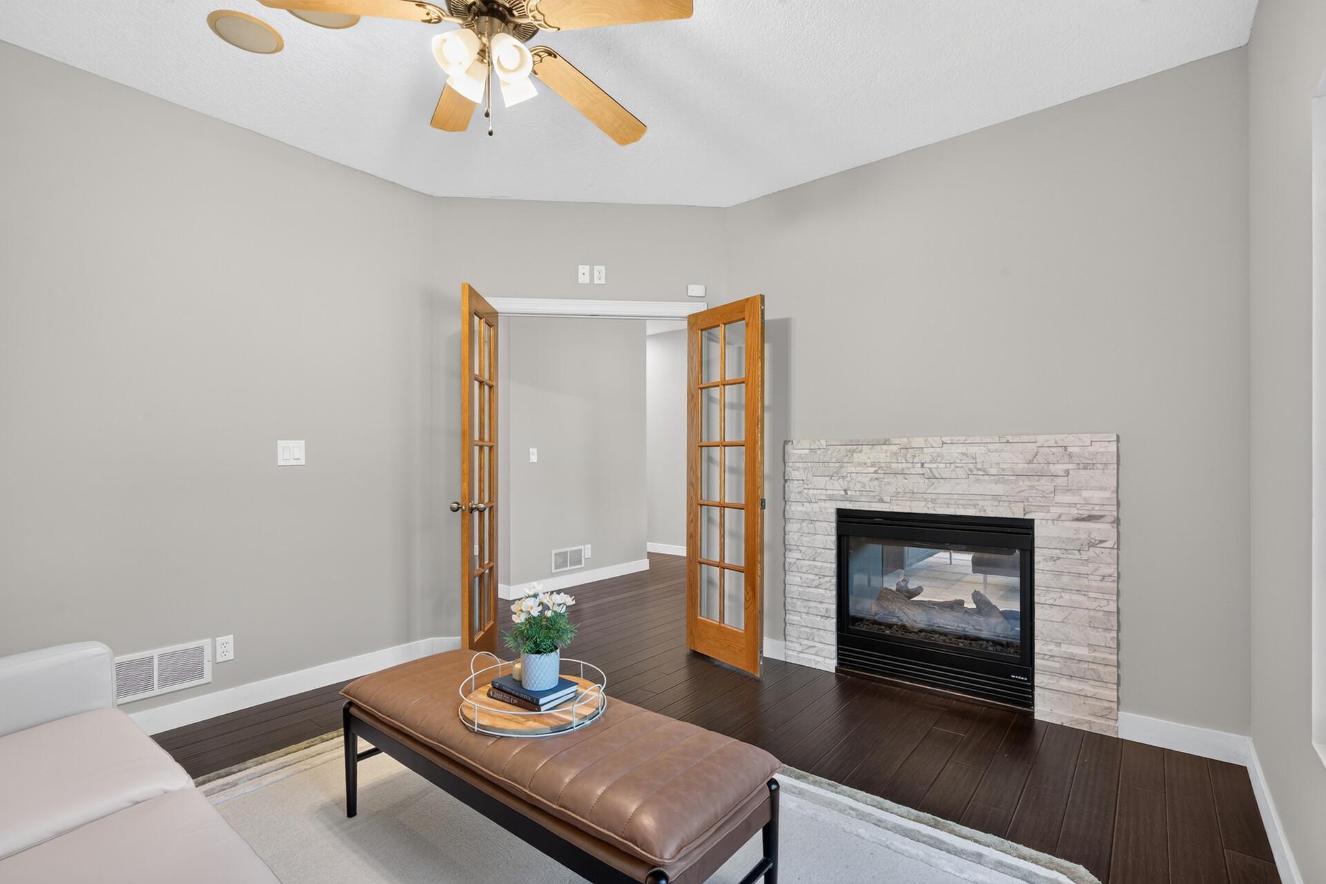 Flex room, can be an office, has a two-sided fireplace.