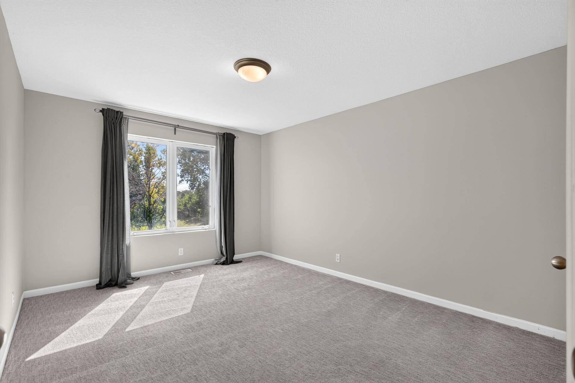 Bedroom 2 with a walk-in closet.