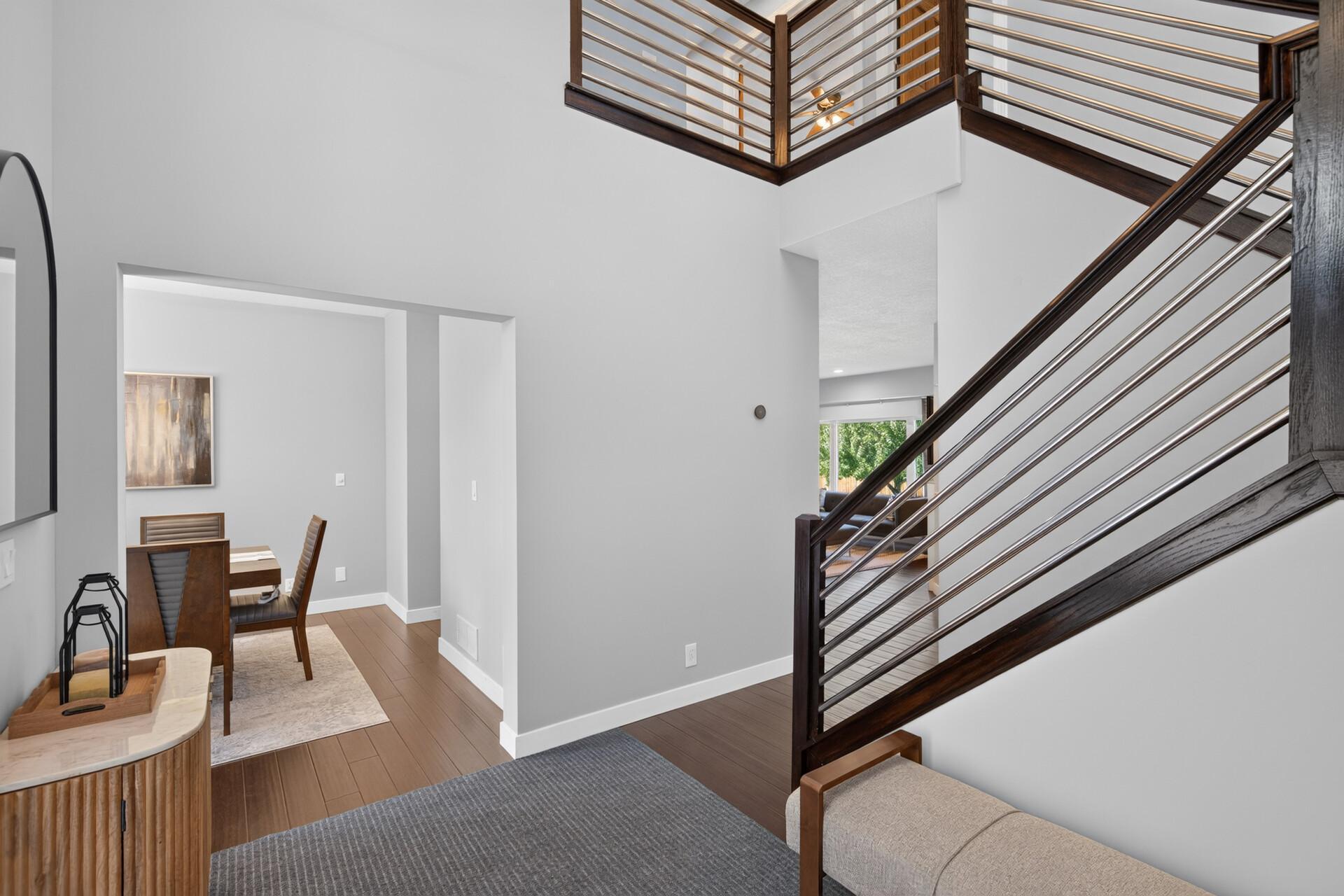Gorgeous two-story foyer with a beautiful modern staircase.
