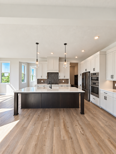 Designer kitchen with quartz countertops, statement tile backsplash, gas cooktop, extended-height cabinetry, and a spacious contrasting island.