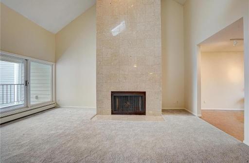 A stunning wood-burning fireplace highlights the living room, perfect for cozy evenings and relaxed gatherings.