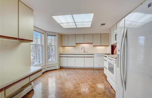 View from the formal dining area into the kitchen, highlighting the homeâs open and connected layout.