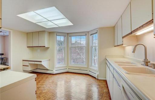 Bright, cheerful kitchen with space for a tableâperfect for casual meals and morning coffee.