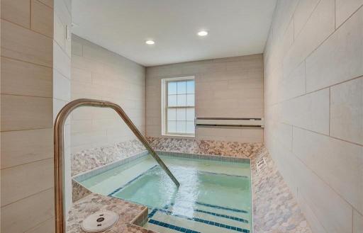 The community features a shared hot tub for all residents, offering a relaxing amenity just steps from home.
