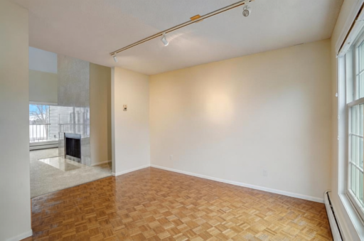 Formal dining room with lake views and open access to living room.