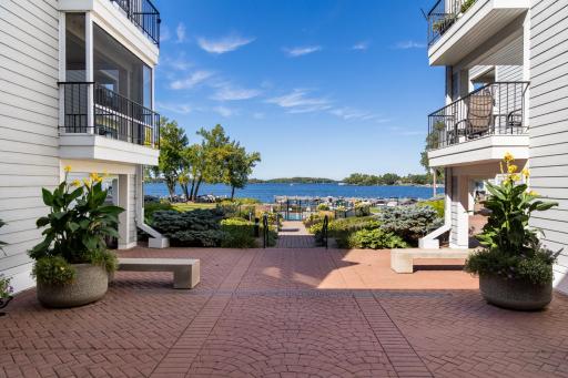 A shared lakeside patio offers peaceful views of Excelsior Bay, creating a serene gathering space for all residents.