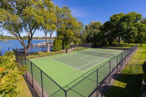 Amenity-rich community tennis courts situated along the lake, providing a stunning and active outdoor space for residents.
