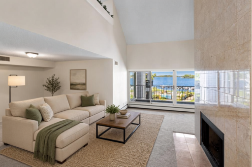 Virtually Staged - Enjoy gorgeous lake views right from the living room, offering a peaceful everyday connection to the water.