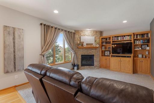 Main floor Family Room with a gas Fireplace & custom built in entertainment center.