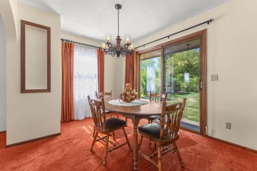 Dining room with patio door to the backyard.