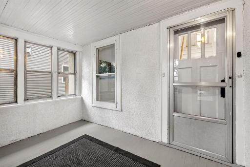 Step inside the fully screen front porch.