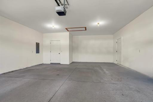 Spacious 2 car garage, finished walls and utility room with zero steps entry into the home.