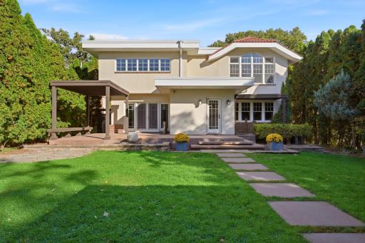 The flat, fully fenced backyard provides another spot to enjoy nature, play yard games or read a book.