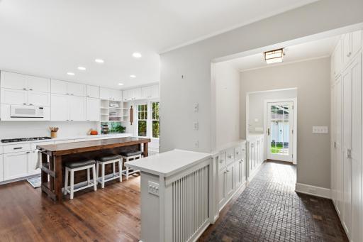 The home offers a mudroom and hallway for stowing all the Minnesota coats and boots and both areas have in floor heating.