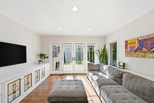 The family room leads out to the private backyard and also features custom built-ins.