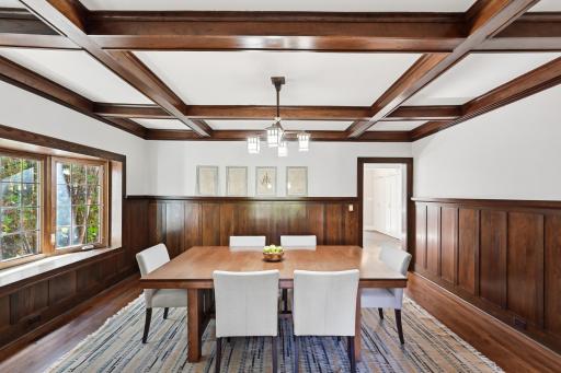 Wow! The large formal dining room has a coffered ceiling, bay window and beautiful wainscoting.