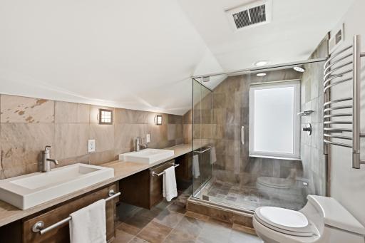 Upstairs 3/4 bathroom with heated towel bars.