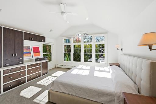 The primary bedroom has numerous built-ins, vaulted ceilings and large walk-in closet.