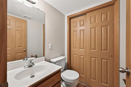 Main Level Powder Room: A convenient main-floor half bath offers fresh paint and easy access for guests