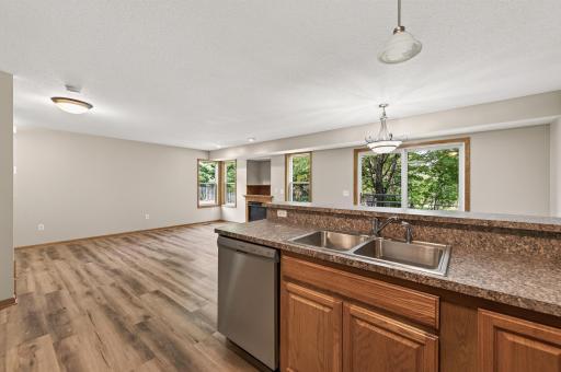 Kitchen: The updated kitchen features brand-new stainless steel appliances and flows directly into the dining area.