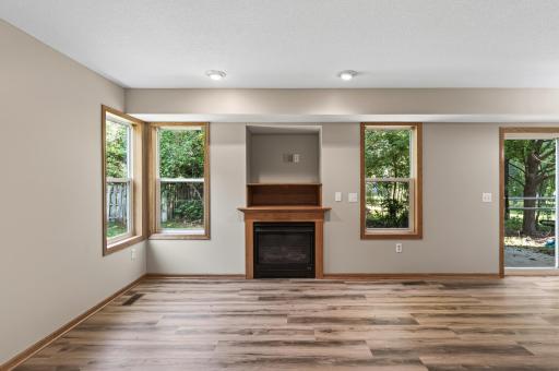 Living Room: Bright and inviting, the main living space features fresh paint throughout and a cozy gas fireplace perfect for relaxing.