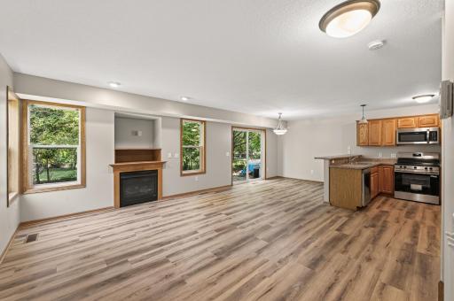 Open Main Level: A functional, open floor plan connects the living, dining, and kitchen areas with brand-new LVP flooring throughout.