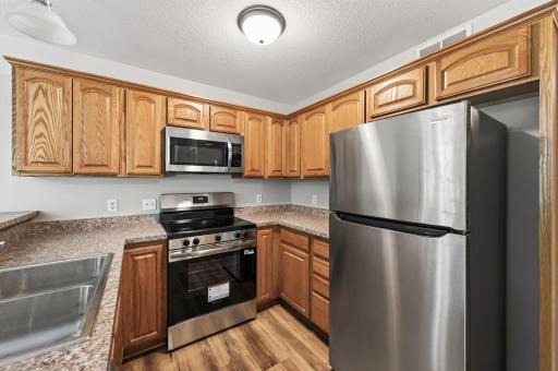 Kitchen: Cook with style in this refreshed kitchen, featuring brand-new stainless steel appliances and clean finishes.