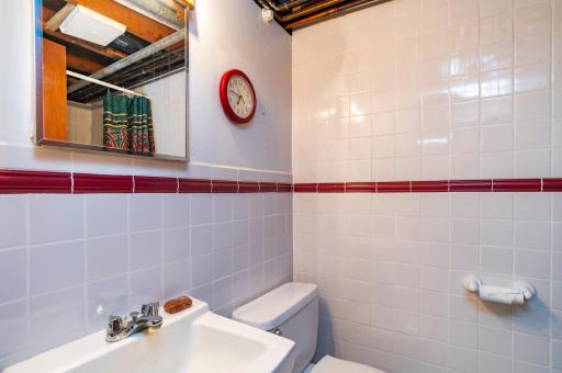 Lower level 3/4 bath with walk in tiled shower.