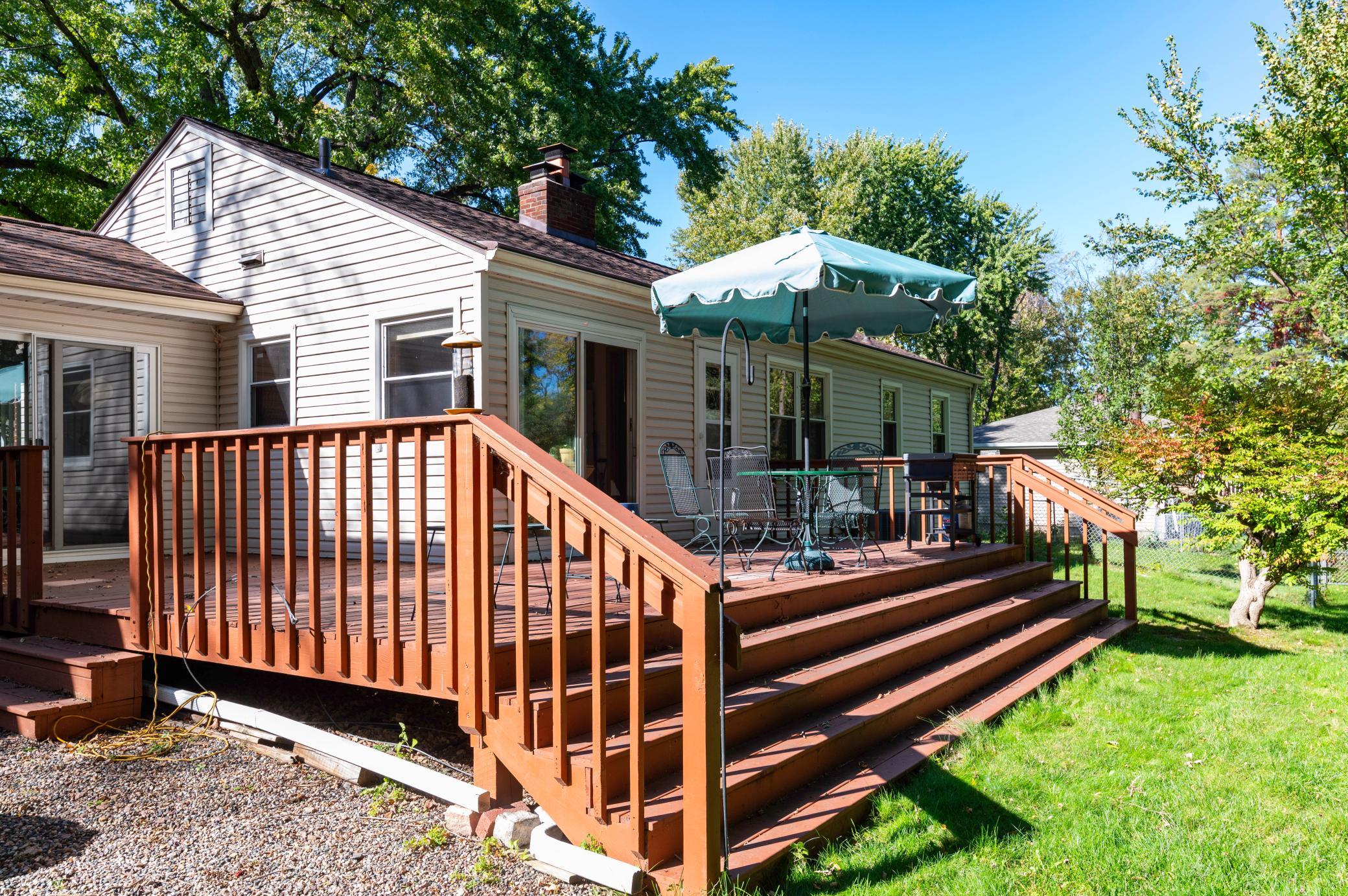 The back of this home has an abundance of east facing windows offering lots of morning sunshine. This large deck is a great space for outdoor living and entertaining.