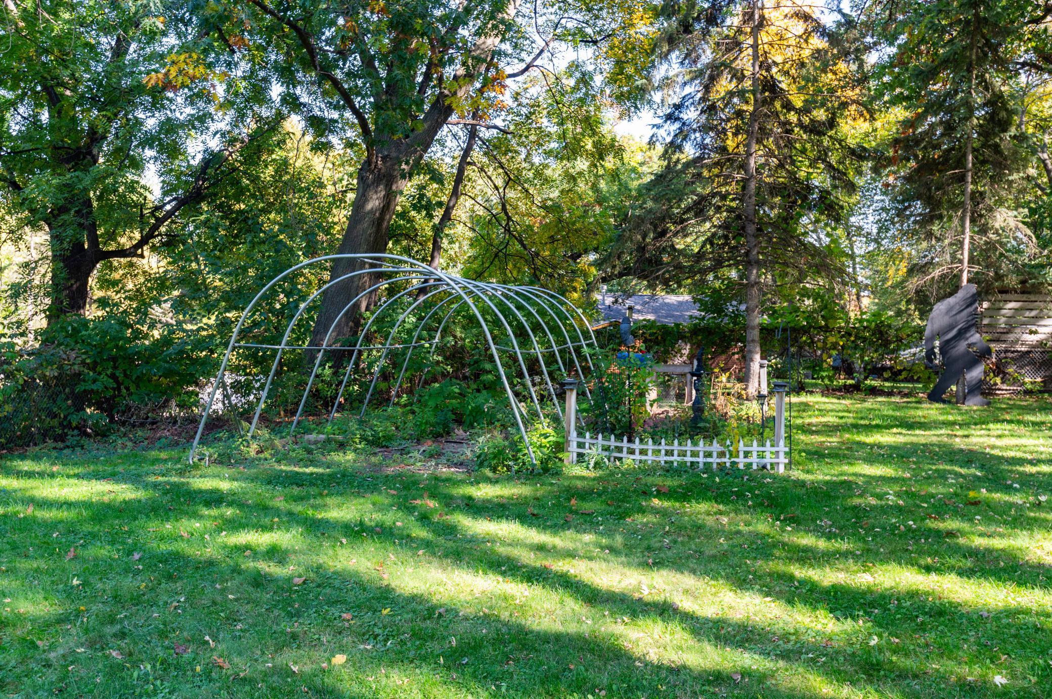 The large level and private backyard is perfect for recreation and gardening.